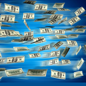 Image of cash flowing against a blue background.